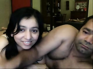 Naughty guy with his friends wife in bedroom caressing her navel