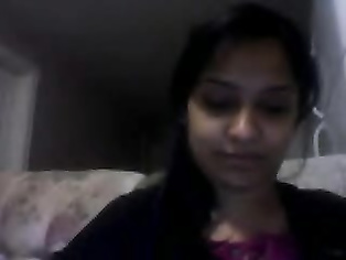 Sweet Noida girl Angel sitting naked on webcam pressing her boob and fingering her hairy pussy.