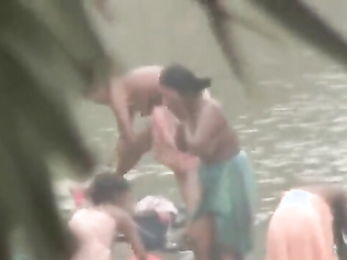 Tamil women bathing by the river