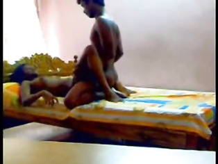 Hot South Indian couple enjoying sex in their bedroom.